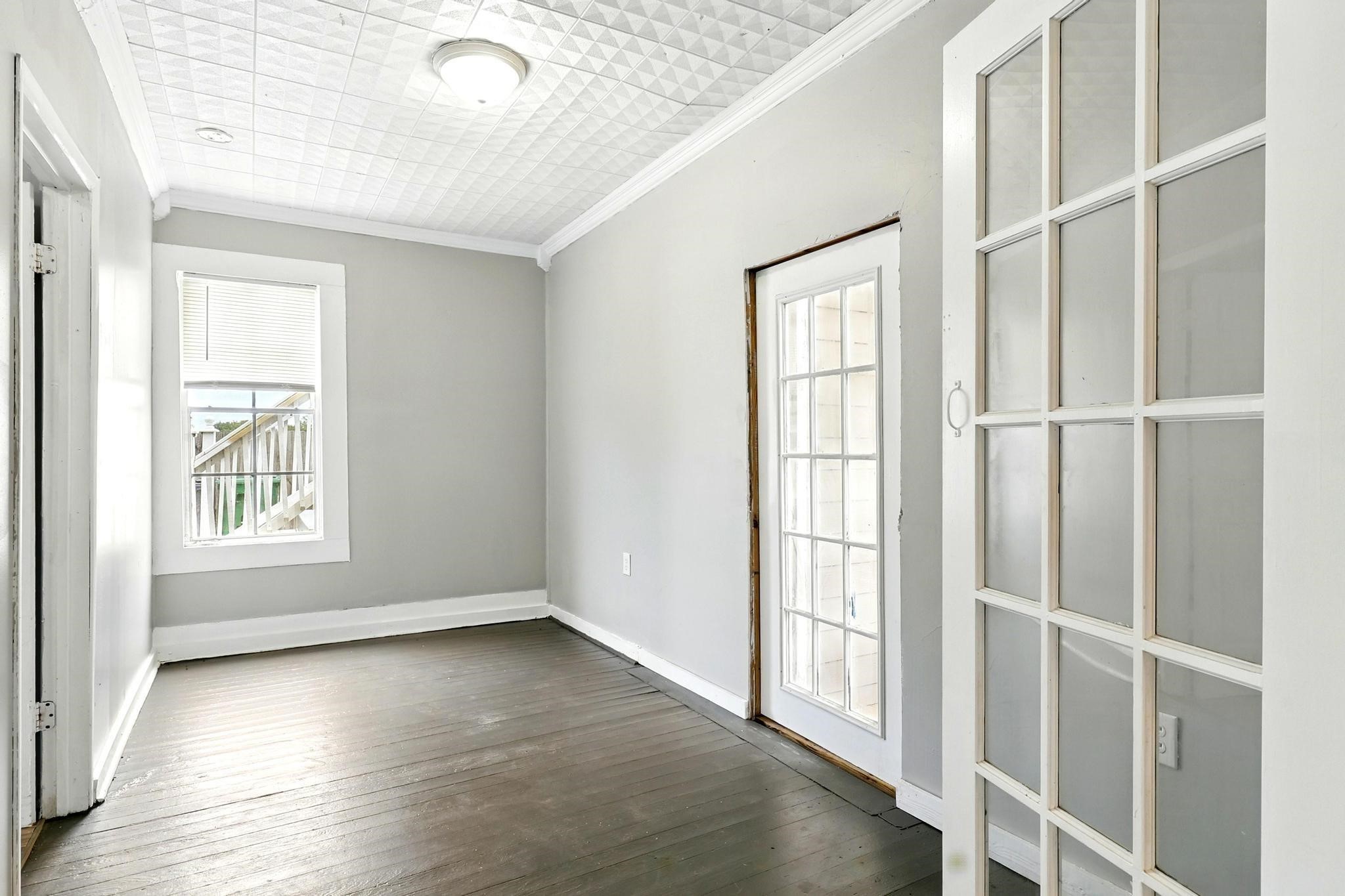 307 Shepard Lane Brenham, TX 77833 - Photo 15 of 47 an empty room with wooden floor and windows