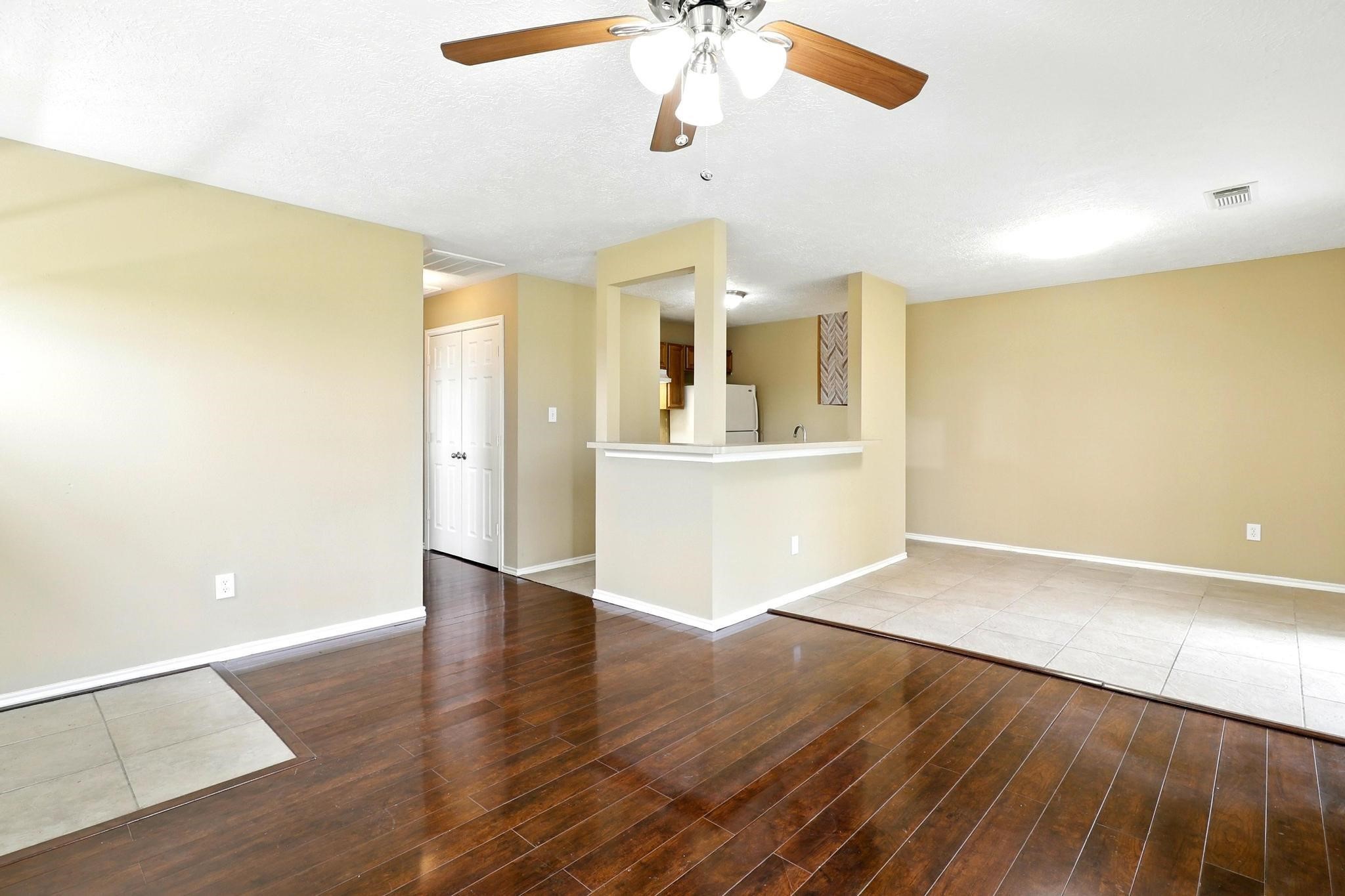 307 Shepard Lane Brenham, TX 77833 - Photo 26 of 47 an empty room with wooden floor and windows