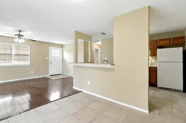 an empty room with windows and entrance