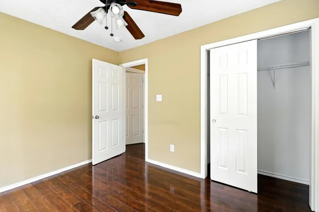 a view of a room with wooden floor