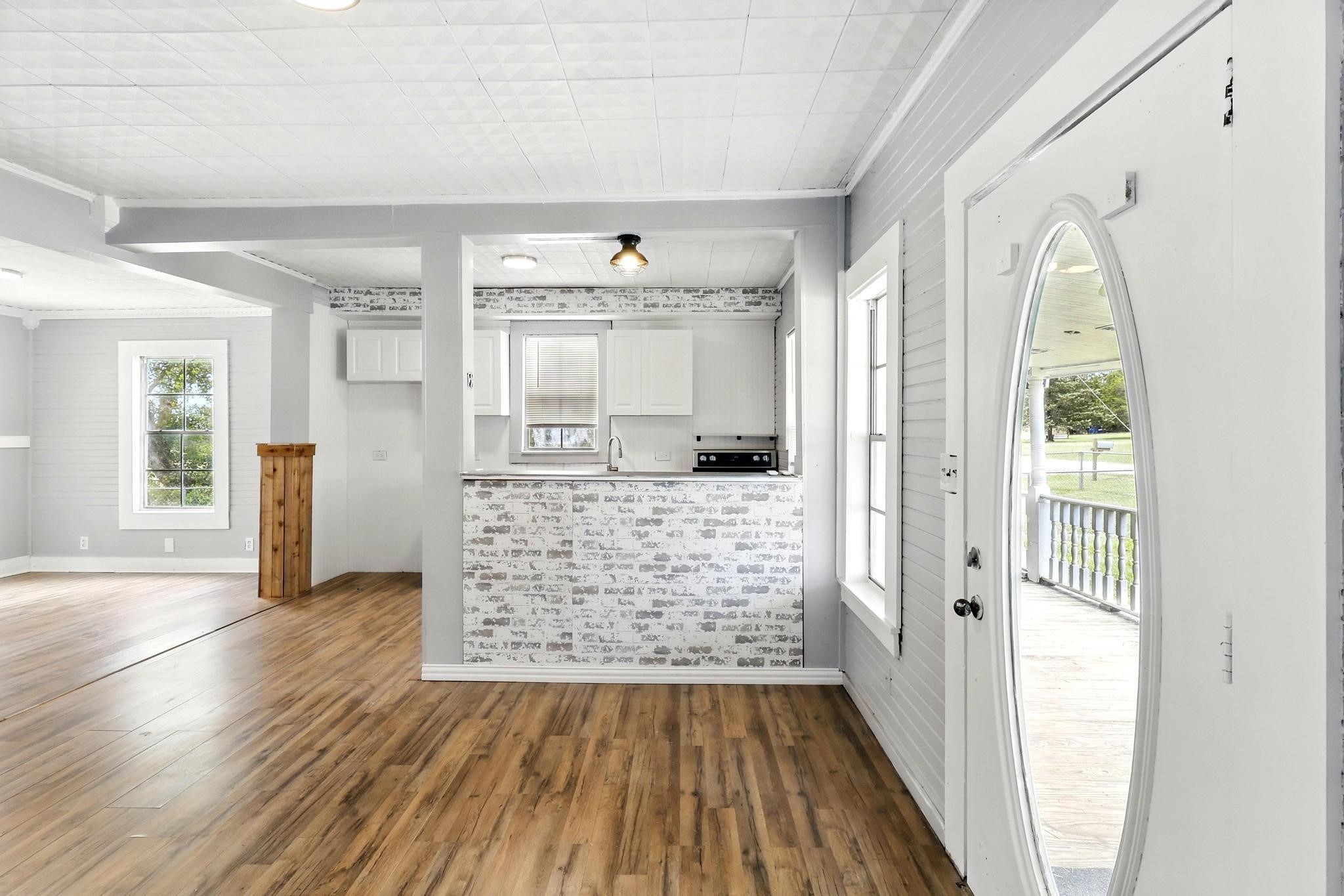 307 Shepard Lane Brenham, TX 77833 - Photo 4 of 47 wooden floor in an empty room with a window