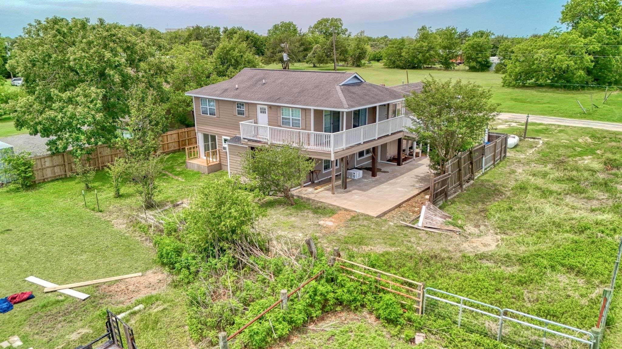 307 Shepard Lane Brenham, TX 77833 - Photo 44 of 47 a aerial view of a house with swimming pool and green space