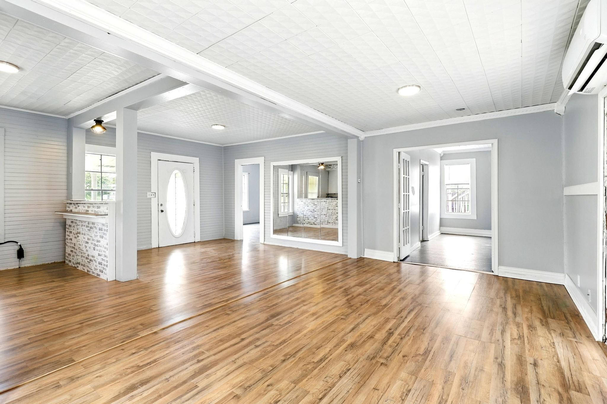 307 Shepard Lane Brenham, TX 77833 - Photo 10 of 47 a view of an empty room with wooden floor and a window