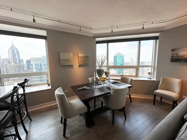 a view of a dining room with furniture window and outside view