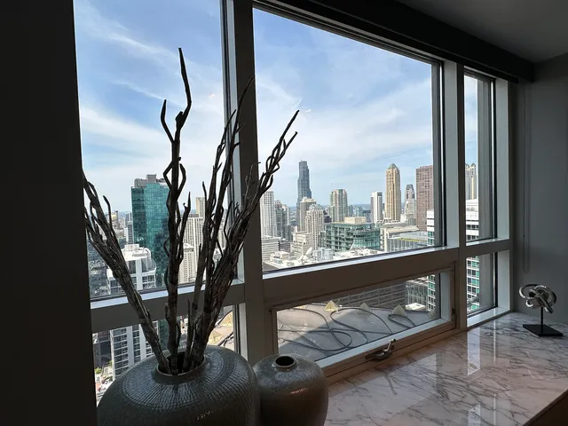 a view of roof deck with furniture