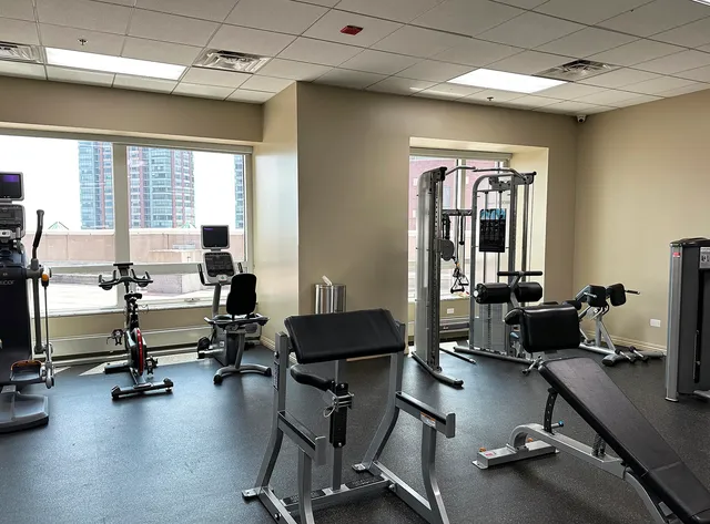 a view of a livingroom with workspace and a window