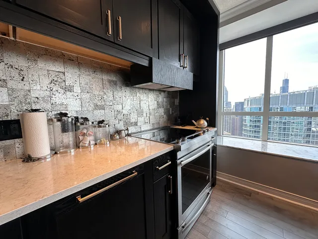a kitchen with a sink and cabinets