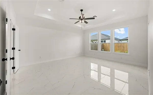 a view of an empty room with a window