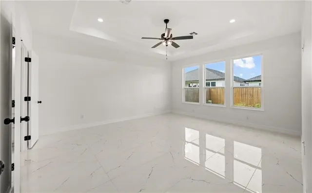 a view of an empty room with a window