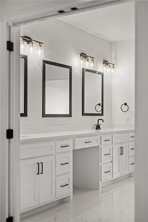 a spacious bathroom with double sink and a mirror