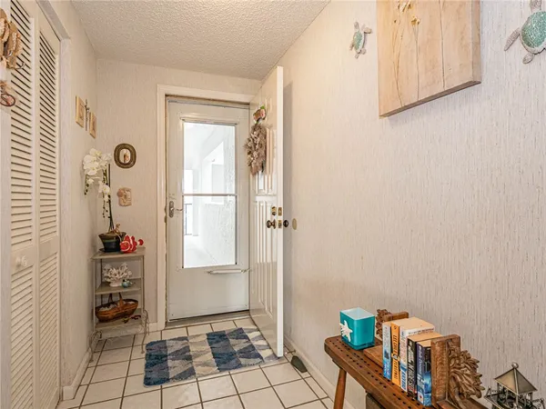 a bathroom with a sink a large mirror and a window