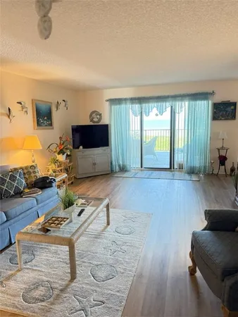 a bathroom with a granite countertop sink mirror vanity and toilet