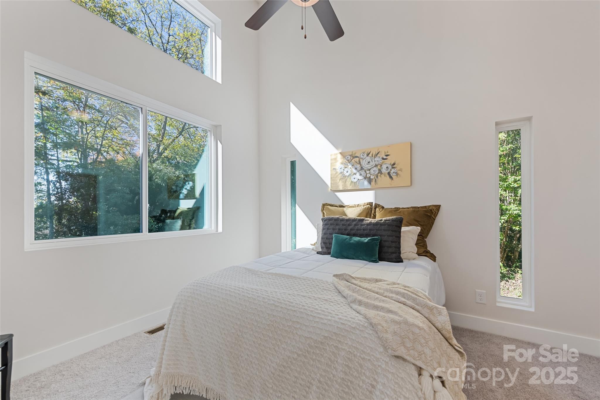 1807 Fisher Crk Road Sylva, NC 28779 - Photo 11 of 37 a bed sitting in a bedroom next to a window
