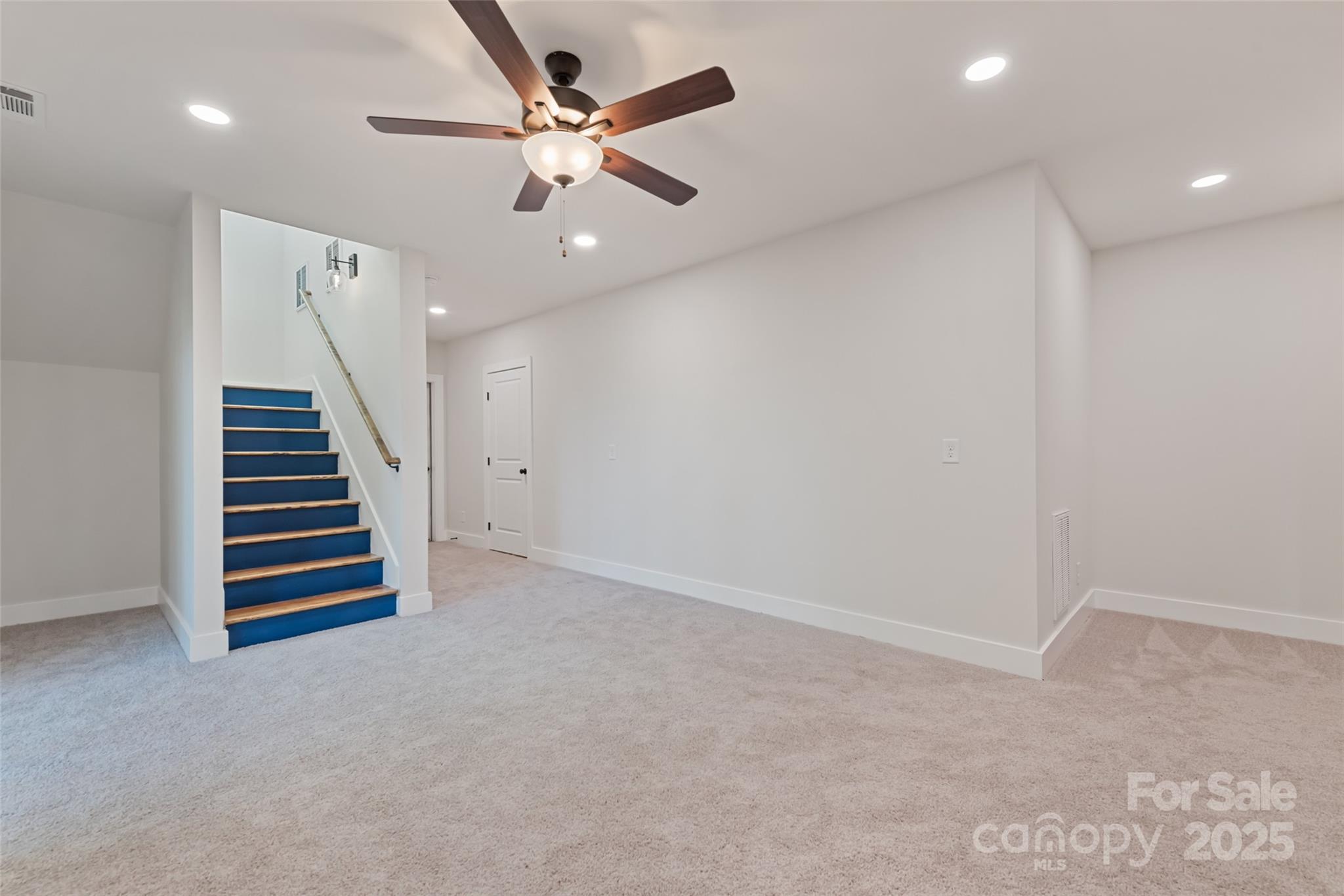 1807 Fisher Crk Road Sylva, NC 28779 - Photo 23 of 37 an empty room with stairs and a ceiling fan
