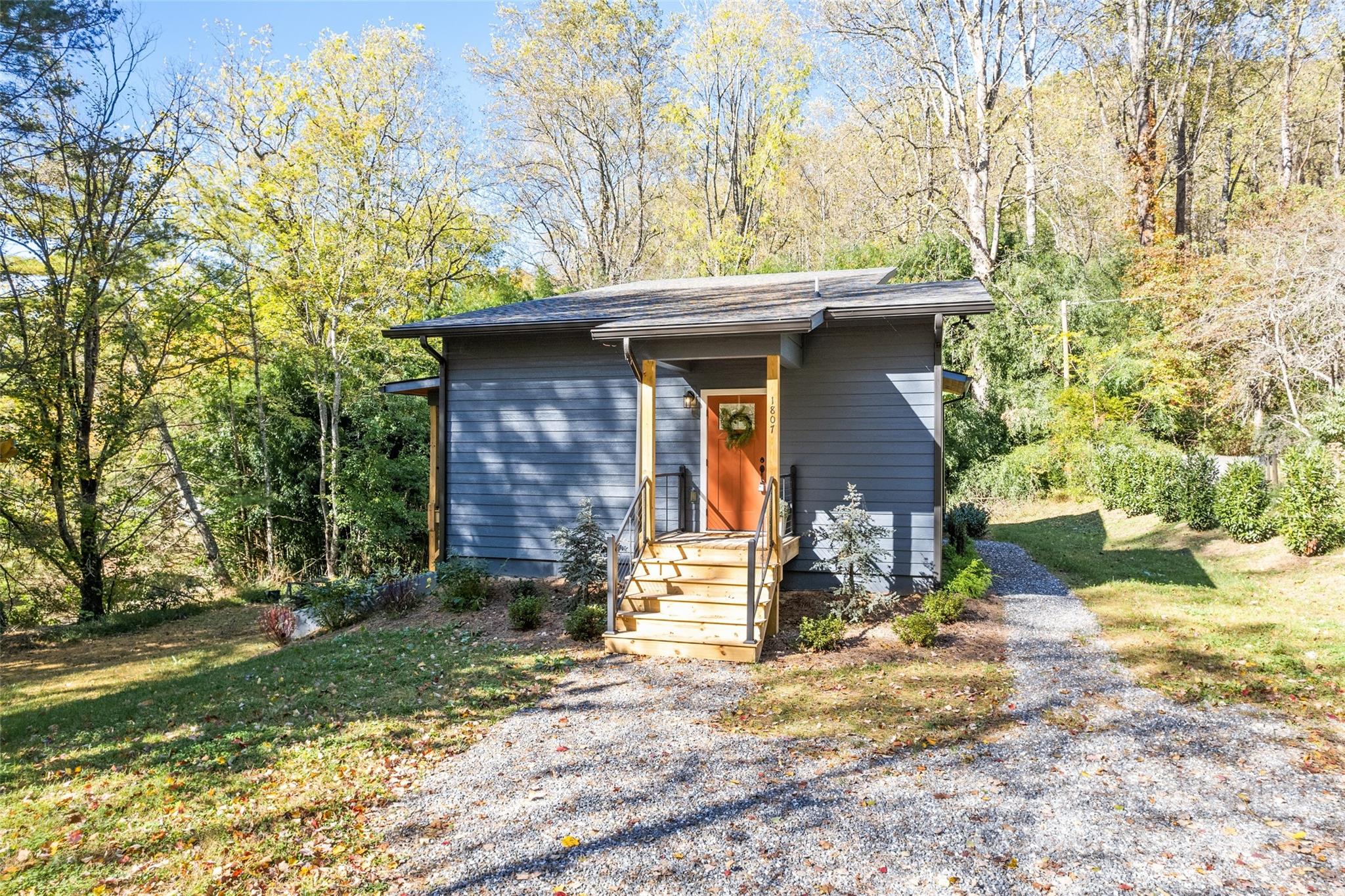 1807 Fisher Crk Road Sylva, NC 28779 - Photo 31 of 37 a front view of a house with a yard
