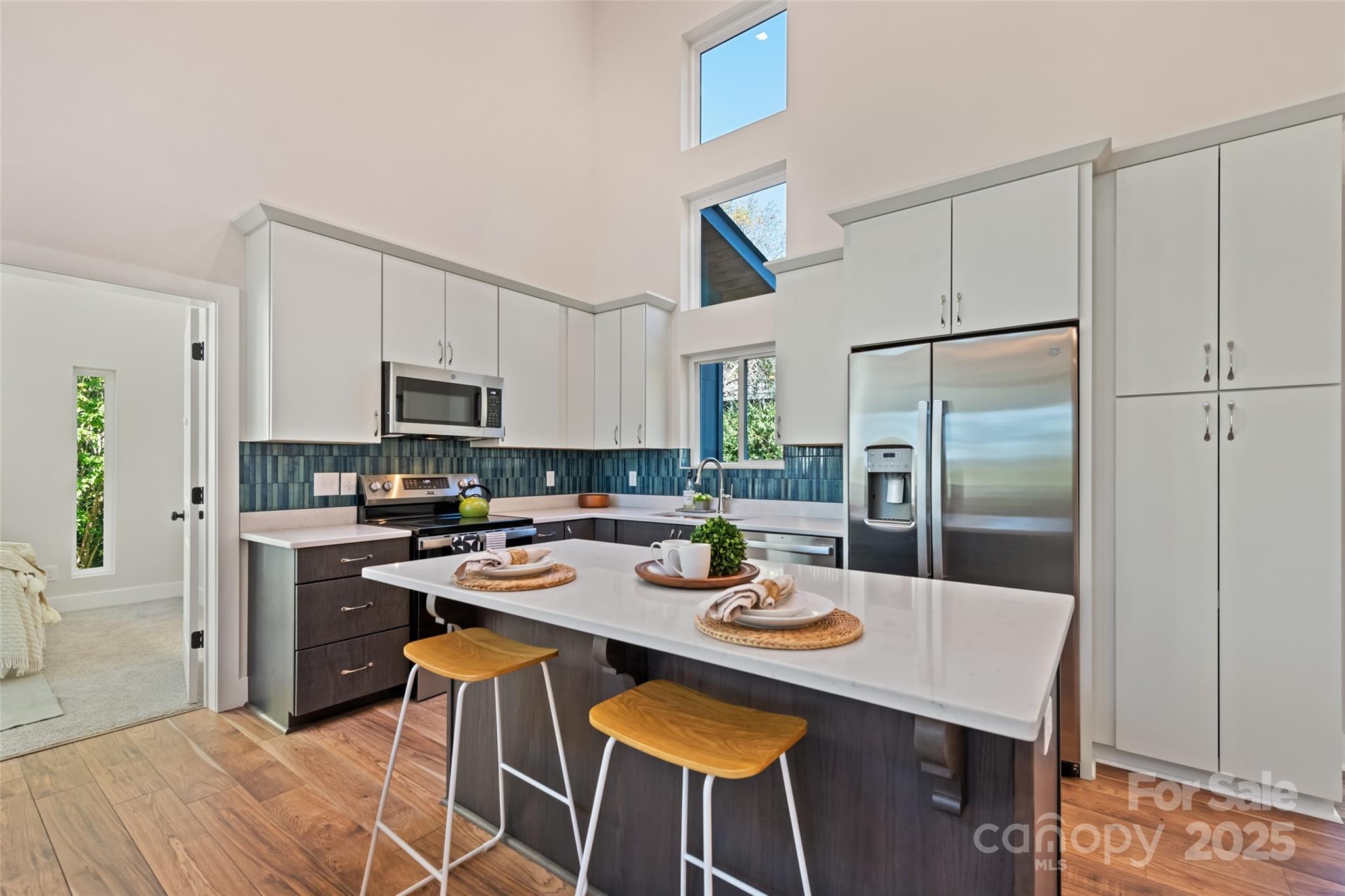 1807 Fisher Crk Road Sylva, NC 28779 - Photo 6 of 37 a kitchen with a dining table and chairs
