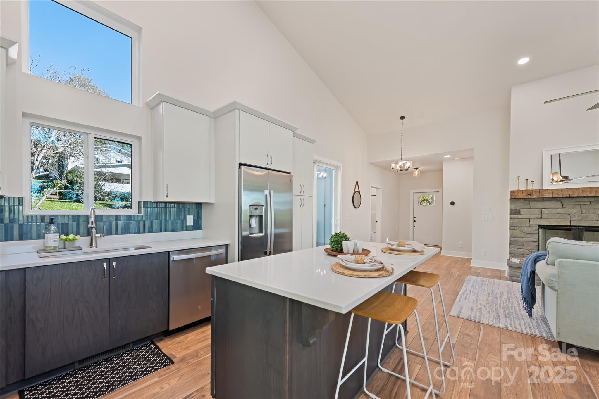 1807 Fisher Crk Road Sylva, NC 28779 - Photo 7 of 37 a open kitchen with stainless steel appliances kitchen island granite countertop a sink and cabinets