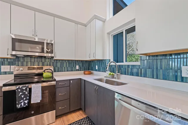 a kitchen with a sink and cabinets