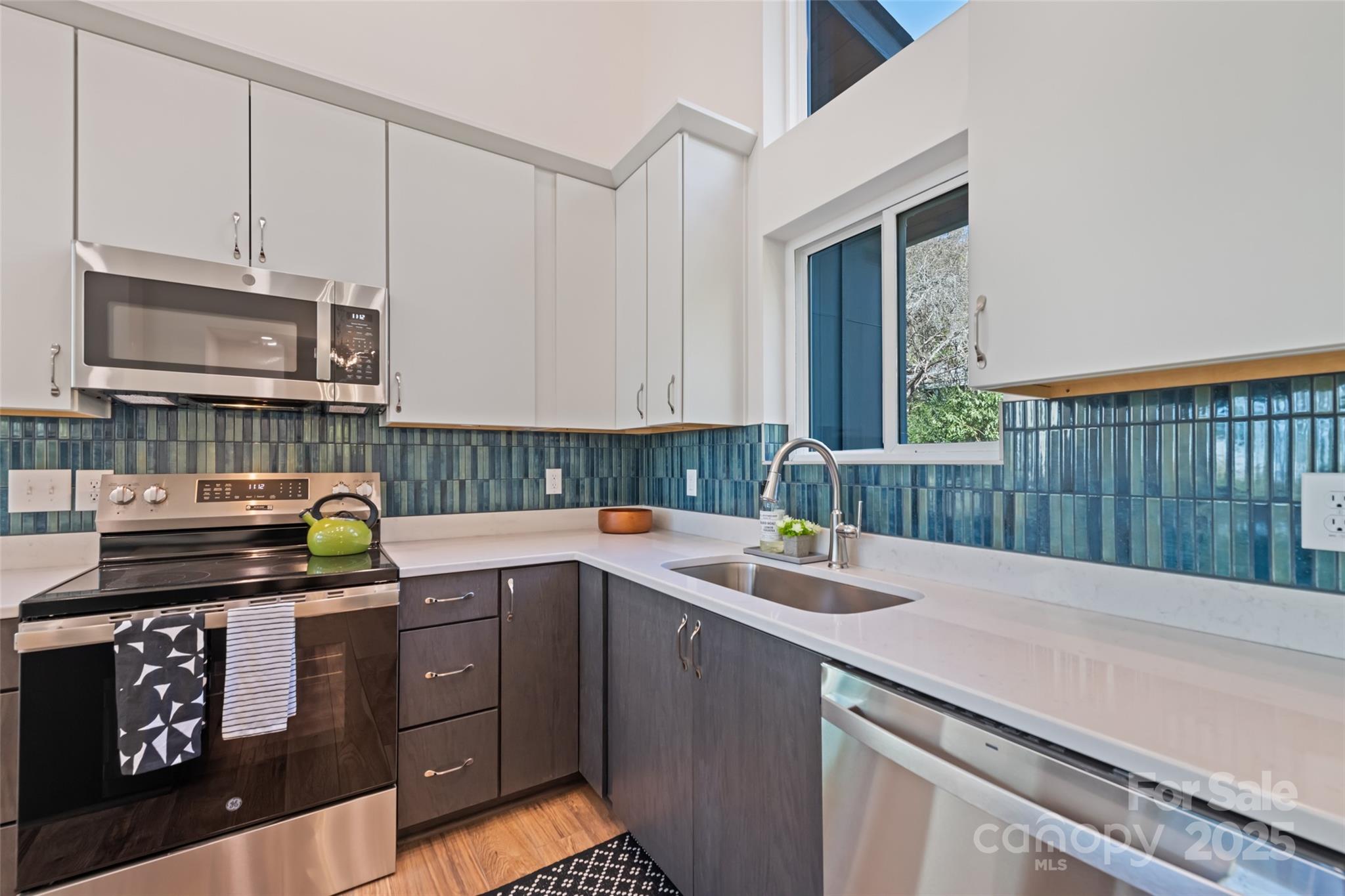 1807 Fisher Crk Road Sylva, NC 28779 - Photo 10 of 37 a kitchen with a sink and cabinets