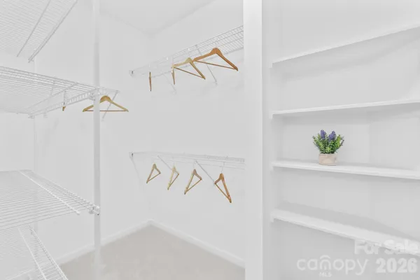 a view of staircase with white walls