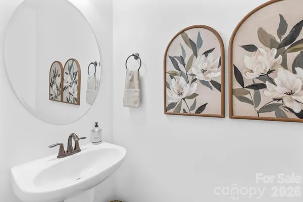 a bathroom with double vanity sinks and a mirror