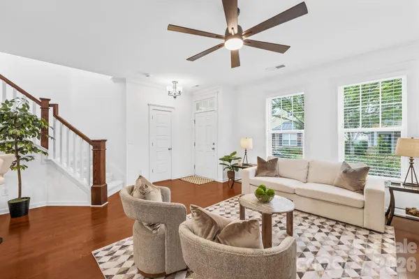 a living room with furniture and a large window