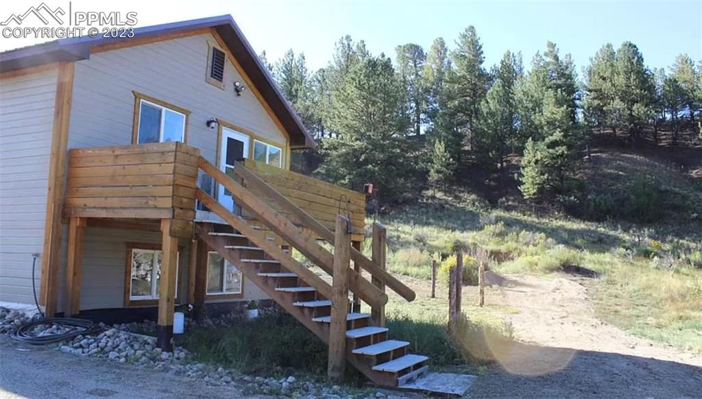 7618 Beekman Road Fort Garland, CO 81133 - Photo 7 of 8 a view of house with a yard