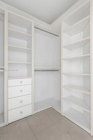 a view of an empty walk in closet