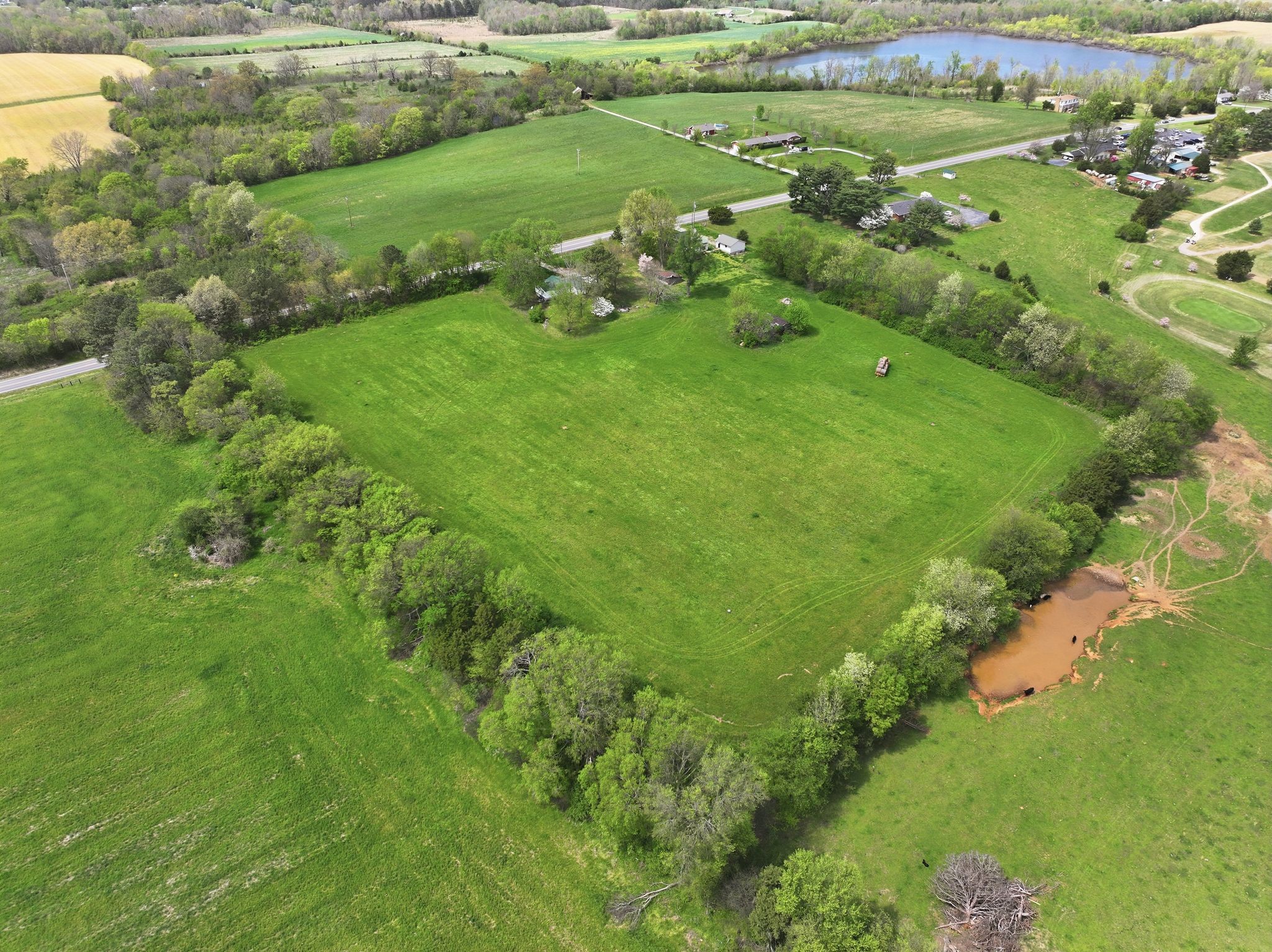 3754 Aedc Road Winchester, TN 37398 - Photo 2 of 30 a view of a green field with lots of bushes