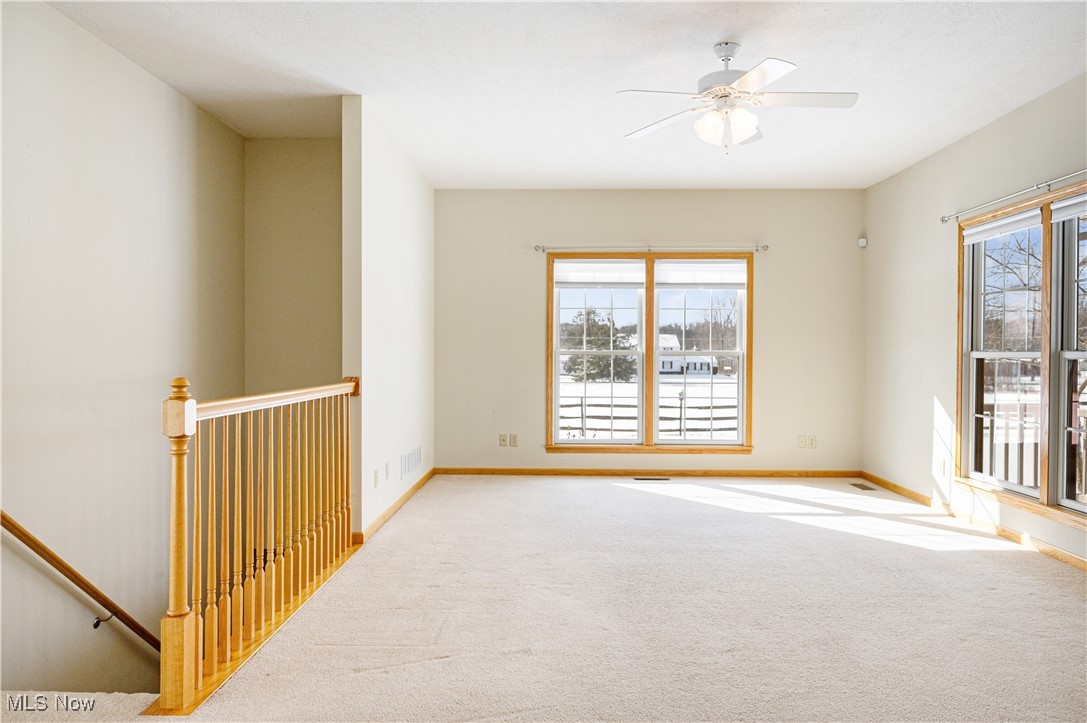 706 Watson Road Deerfield, OH 44411 - Photo 3 of 36 Carpeted spare room with ceiling fan