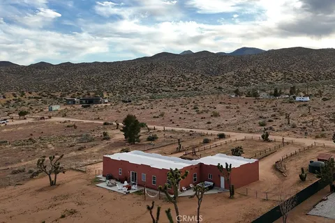 a view of a backyard with sitting area