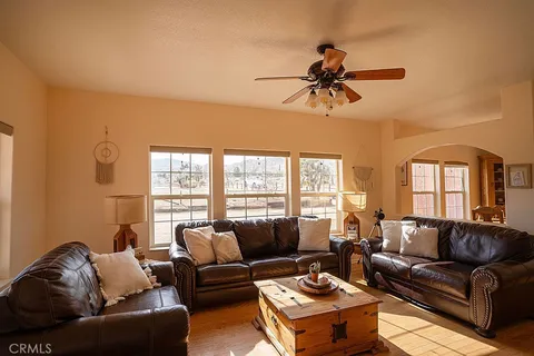 a spacious bathroom with a sink and a mirror