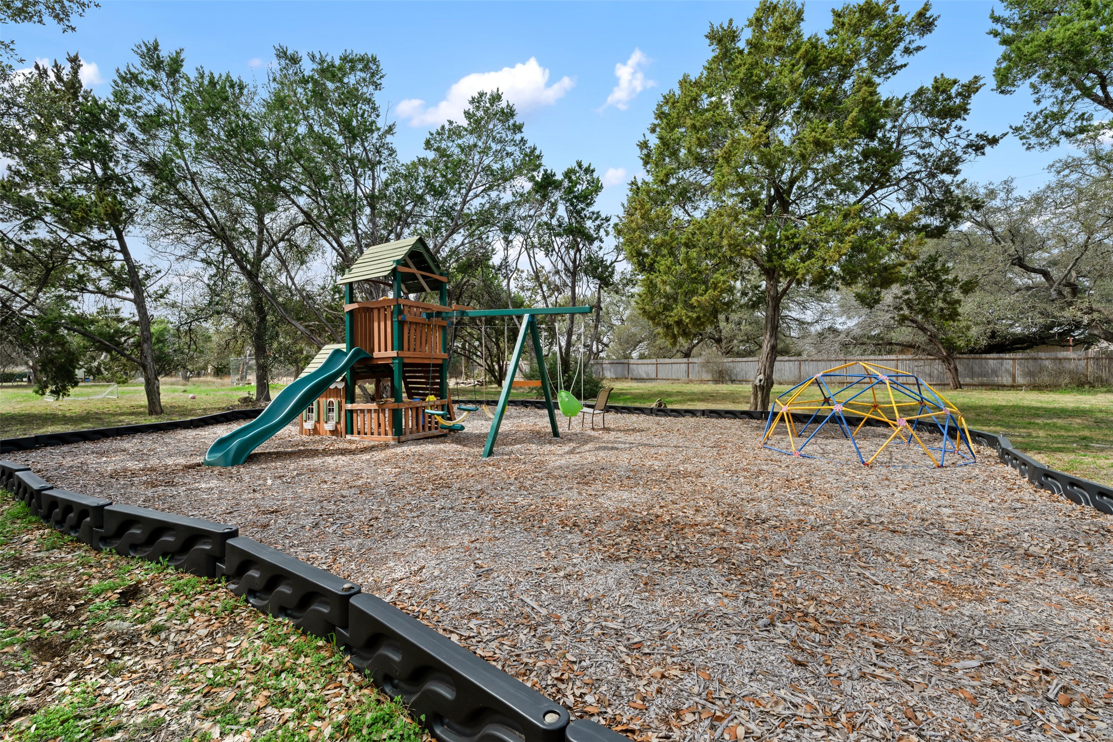 104 Sunset Road Georgetown, TX 78633 - Photo 37 of 40 View of playground area in the backyard.