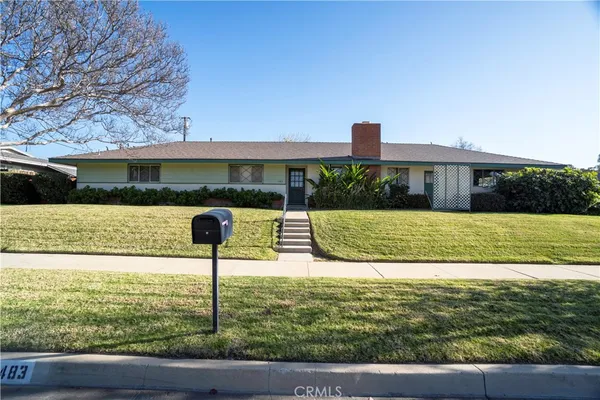 a view of a swimming pool with a garden