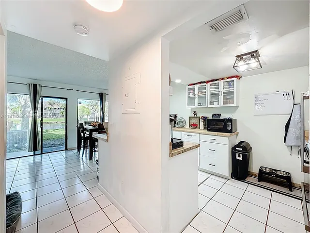 a kitchen with a sink and a stove top oven