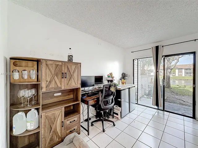 a kitchen with a stove and a refrigerator
