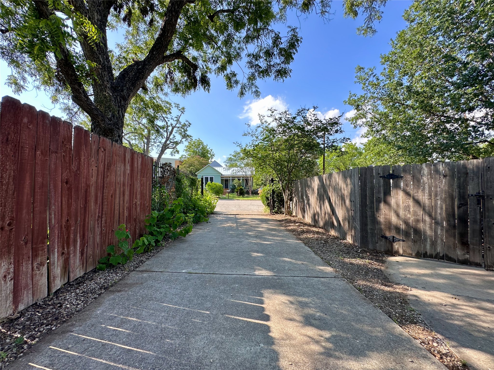 2103 East 16th Street, Unit ANNEX Austin, TX 78702 - Photo 22 of 23 a view of a house with wooden fence next to a road
