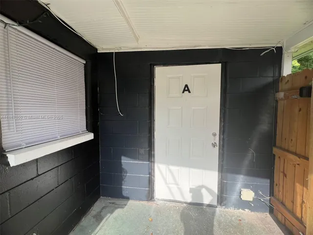 a bathroom with a shower and a sink
