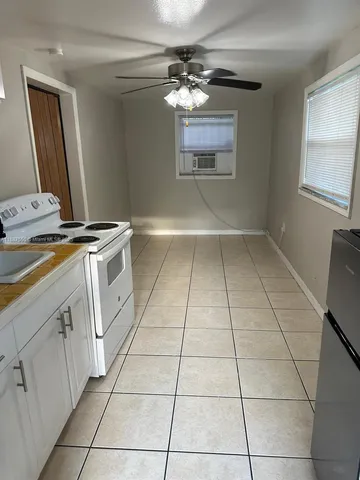 a view of a kitchen with electric appliances