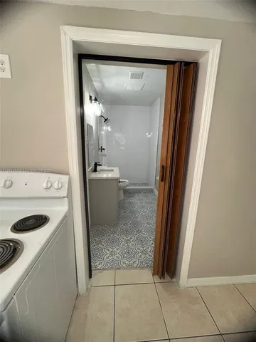 a view of a storage and utility room with washer and dryer