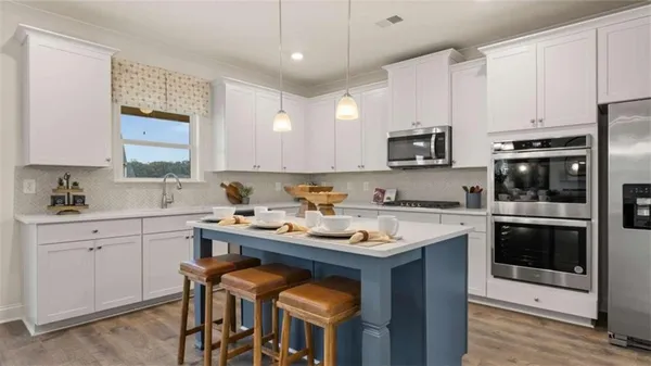 a kitchen with a sink cabinets and window