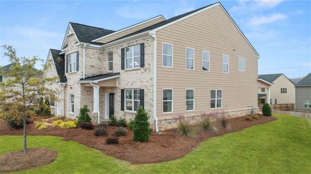 687 Edgar Street Hampton, GA 30228 - Photo 6 of 79 a view of a yard in front of a house