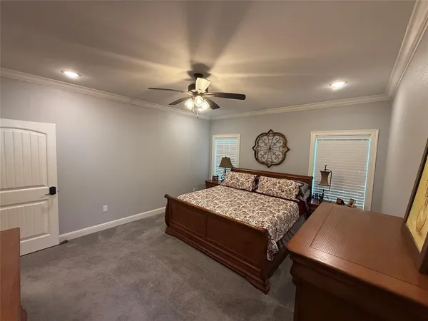 a bed room with a bed and a chandelier