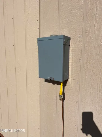 a blue door shower freezer sitting next to a white wall