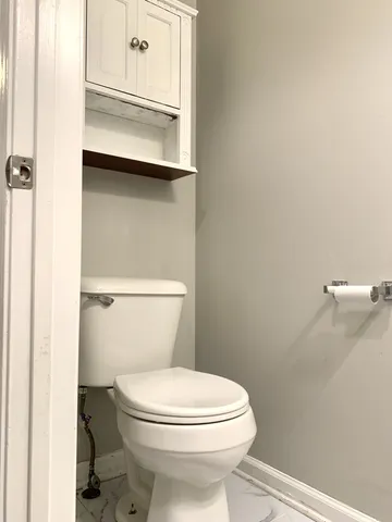 a bathroom with a toilet