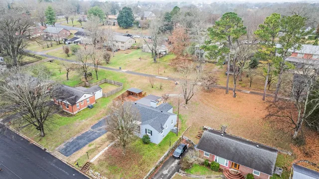 an aerial view of a house with a swimming pool
