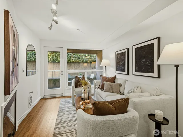 a living room with furniture and a lamp