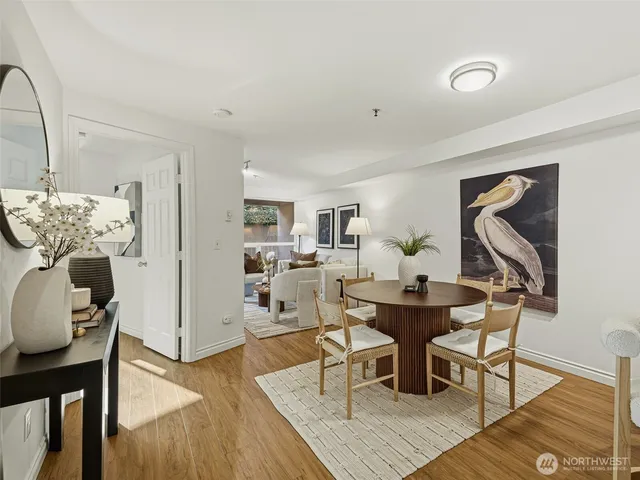a view of a dining room with furniture and wooden floor