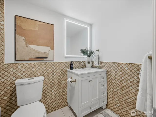 a bathroom with a toilet and a shower curtain