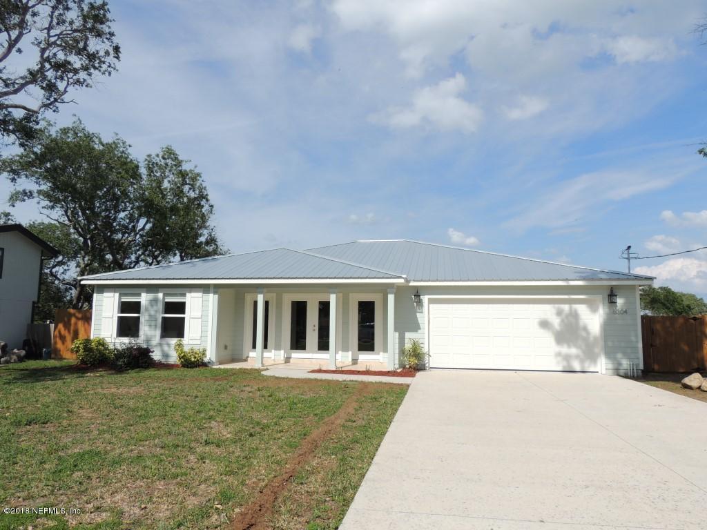 6304 Gomez Road St. Augustine, FL 32080 - Photo 2 of 26 a front view of a house with garden